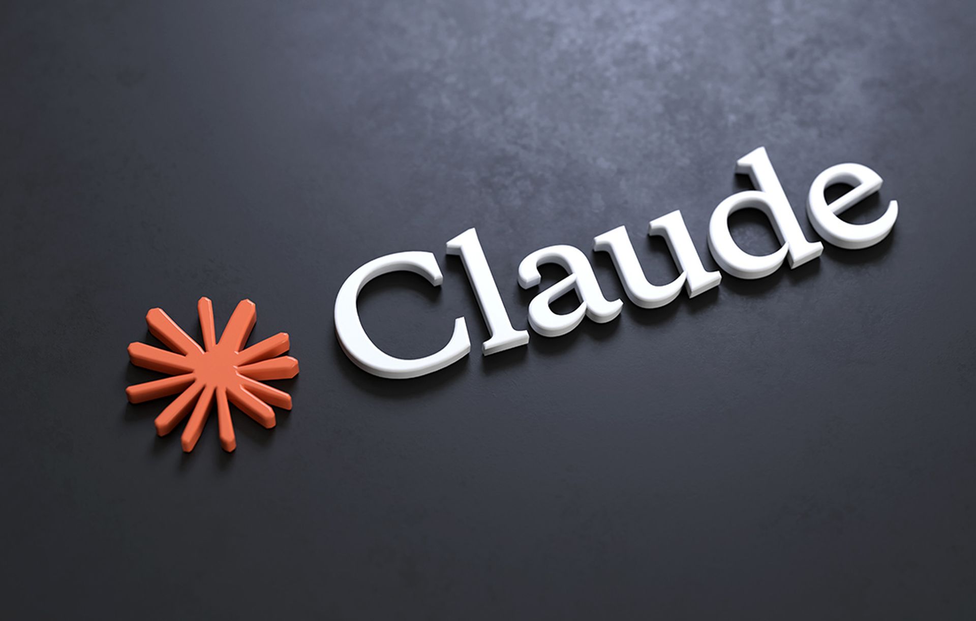 Hình minh hoạ logo Claude dạng 3D nổi trên nền xám đậm, bên trái là biểu tượng ngôi sao tám cánh màu cam san hô, bên phải là chữ "Claude" màu trắng bóng. Tin chính ngày 28/06/2026: Mỹ cho phép Anthropic mở lại Mythos 5 cho khoảng 100 tổ chức hạ tầng quan trọng sau 15 ngày đình chỉ toàn cầu.